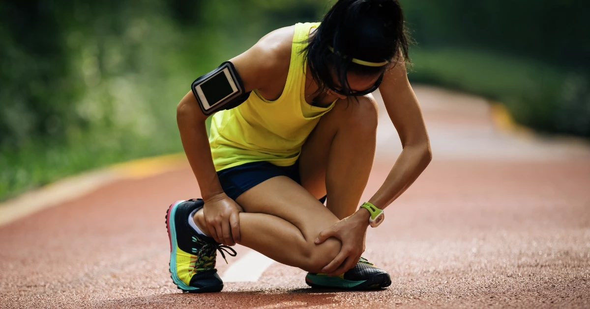 Physical therapist evaluating an athlete's movement after a sports injury