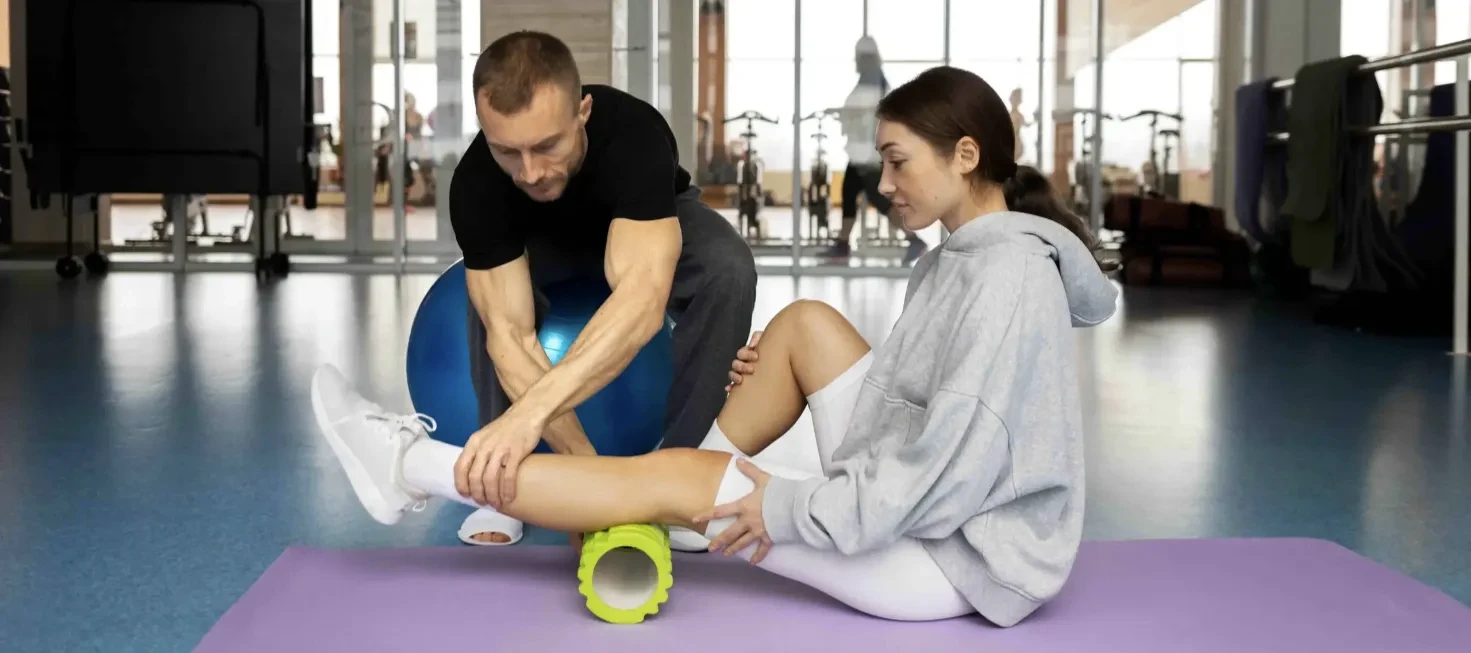 Doctor of Physical Therapy evaluating an athlete's shoulder mobility for sports physical therapy